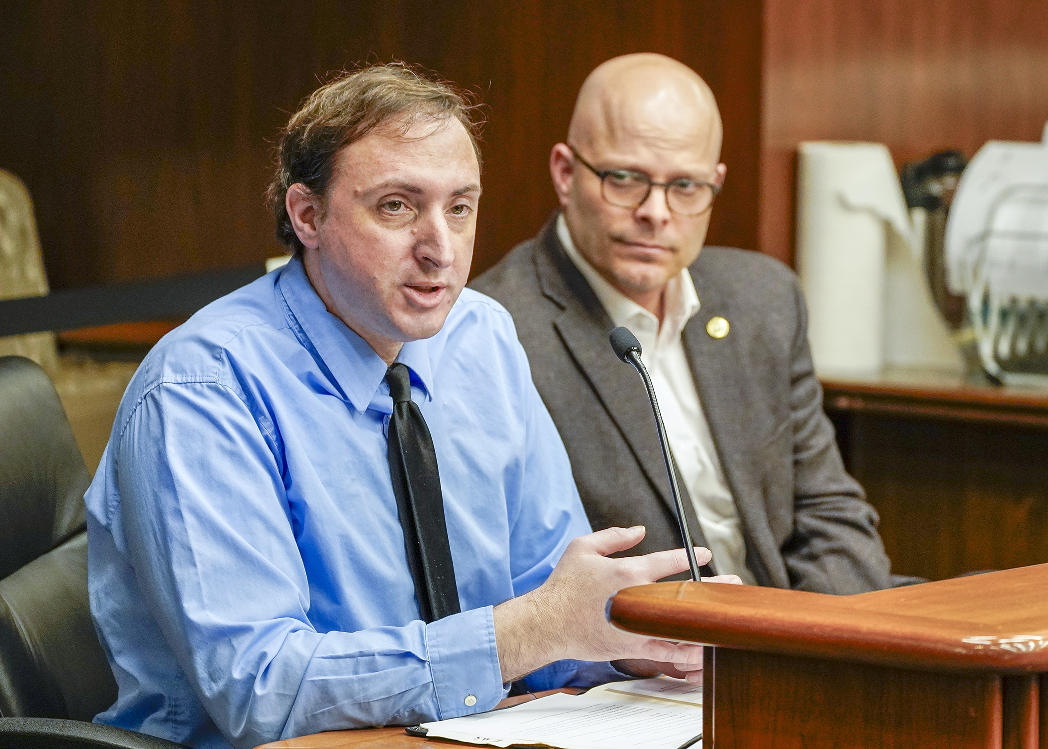 Otter Tail County Emergency Manager Patrick Waletzko testifies March 19 on a bill sponsored by Rep. Dave Lislegard, right, to establish a onetime aid program totaling more than $100 million for licensed ambulance services. (Photo by Andrew VonBank)